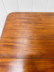 An English Mahogany Breakfast Table with Castors