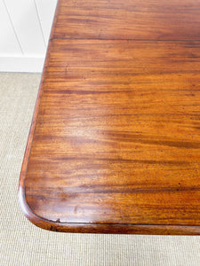 An English Mahogany Breakfast Table with Castors
