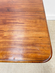 An English Mahogany Breakfast Table with Castors