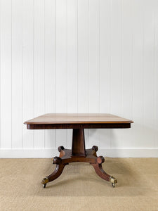 An English Mahogany Breakfast Table with Castors
