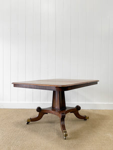 An English Mahogany Breakfast Table with Castors
