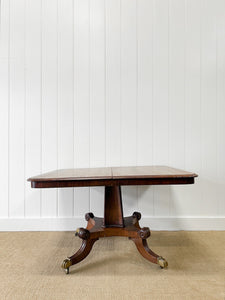 An English Mahogany Breakfast Table with Castors