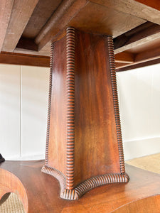 An English Mahogany Breakfast Table with Castors