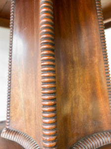 An English Mahogany Breakfast Table with Castors