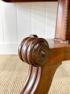 An English Mahogany Breakfast Table with Castors