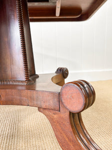 An English Mahogany Breakfast Table with Castors