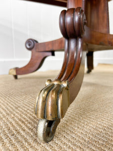 An English Mahogany Breakfast Table with Castors