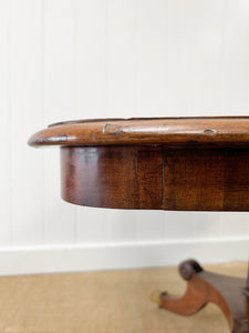 An English Mahogany Breakfast Table with Castors