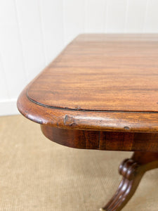 An English Mahogany Breakfast Table with Castors