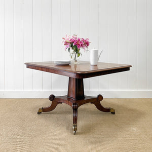 An English Mahogany Breakfast Table with Castors