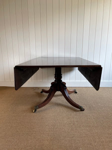 An English Mahogany Drop Leaf Pedestal Breakfast Table c1820